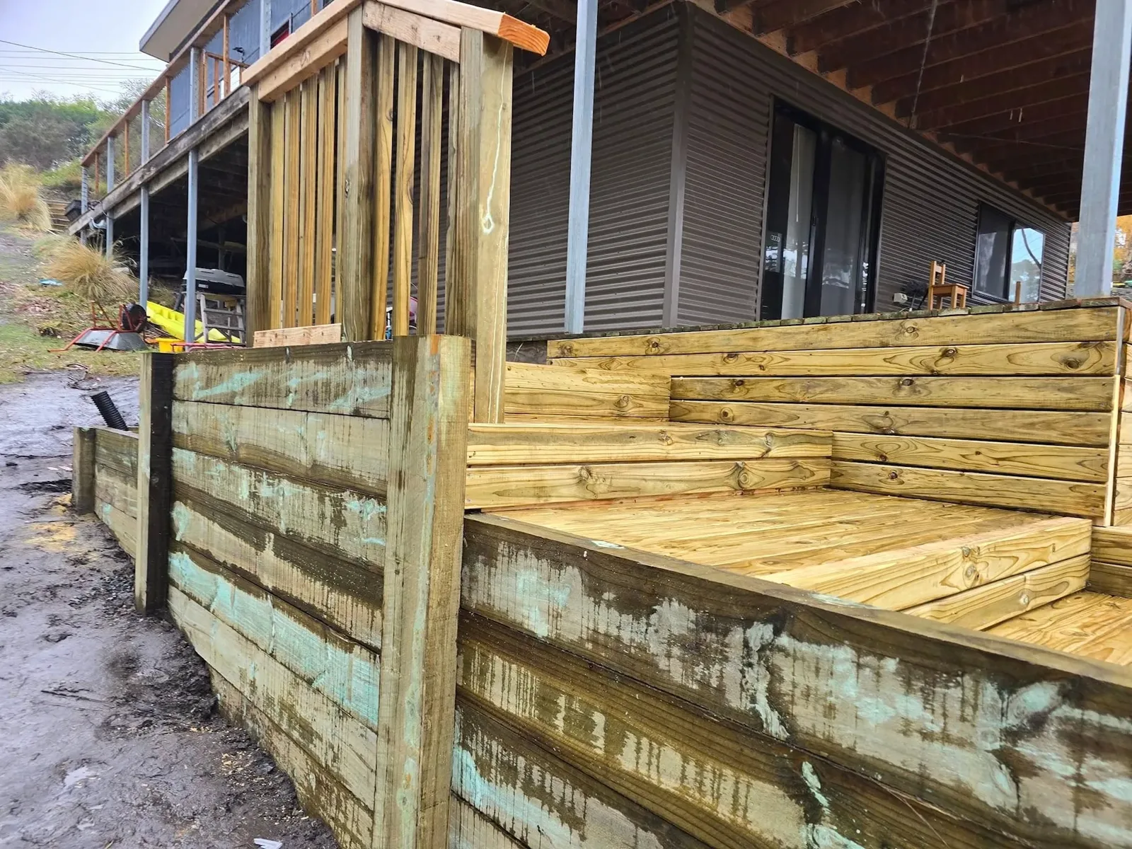Finished timber deck with built-in steps beside a Hobart home
